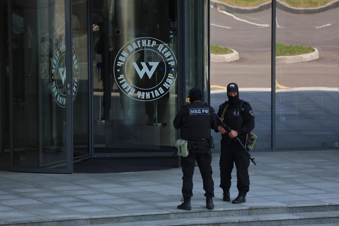 FILE PHOTO: Russian law enforcement officers stand guard outside PMC Wagner Centre in Saint Petersburg, Russia, June 24, 2023. REUTERS/Anton Vaganov/File Photo