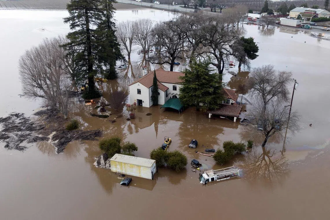An aerial view showing a flooded home partially underwater in Gilroy, California, on Jan 9, 2023.