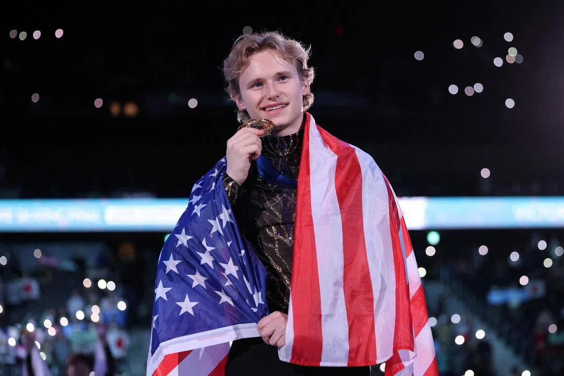 Gold medallist Ilia Malinin of the U.S. celebrates during the men's grand prix final medal ceremony.