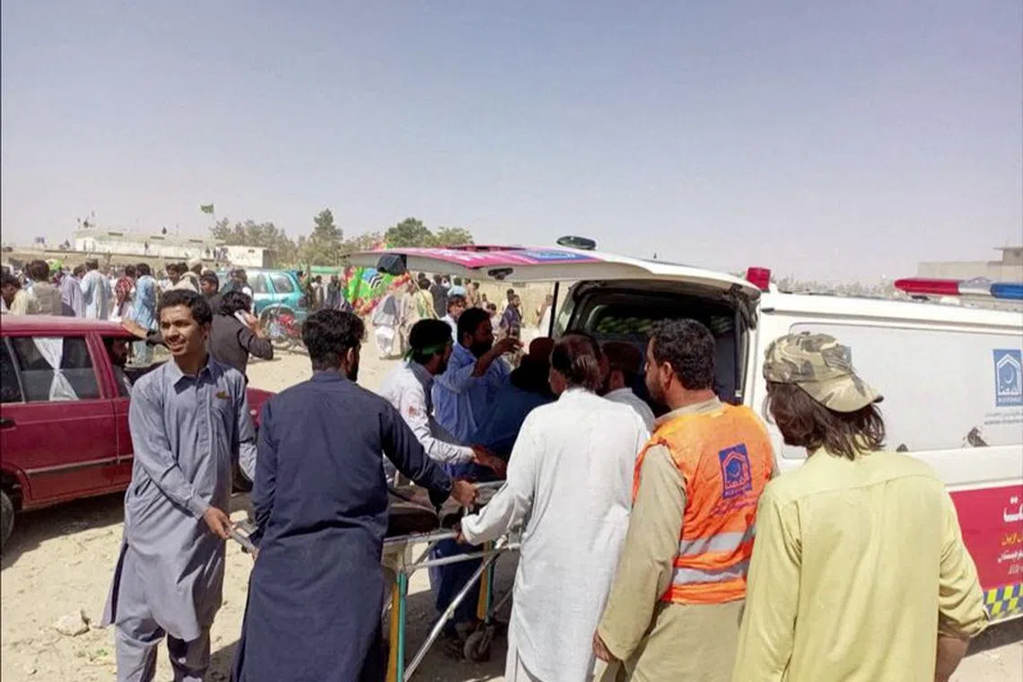 A view of a victim on a stretcher being transferred to an ambulance, following a suicide blast, in Balochistan Province, Pakistan in this screen grab obtained from a video released on September 29, 2023. Video obtained by REUTERS