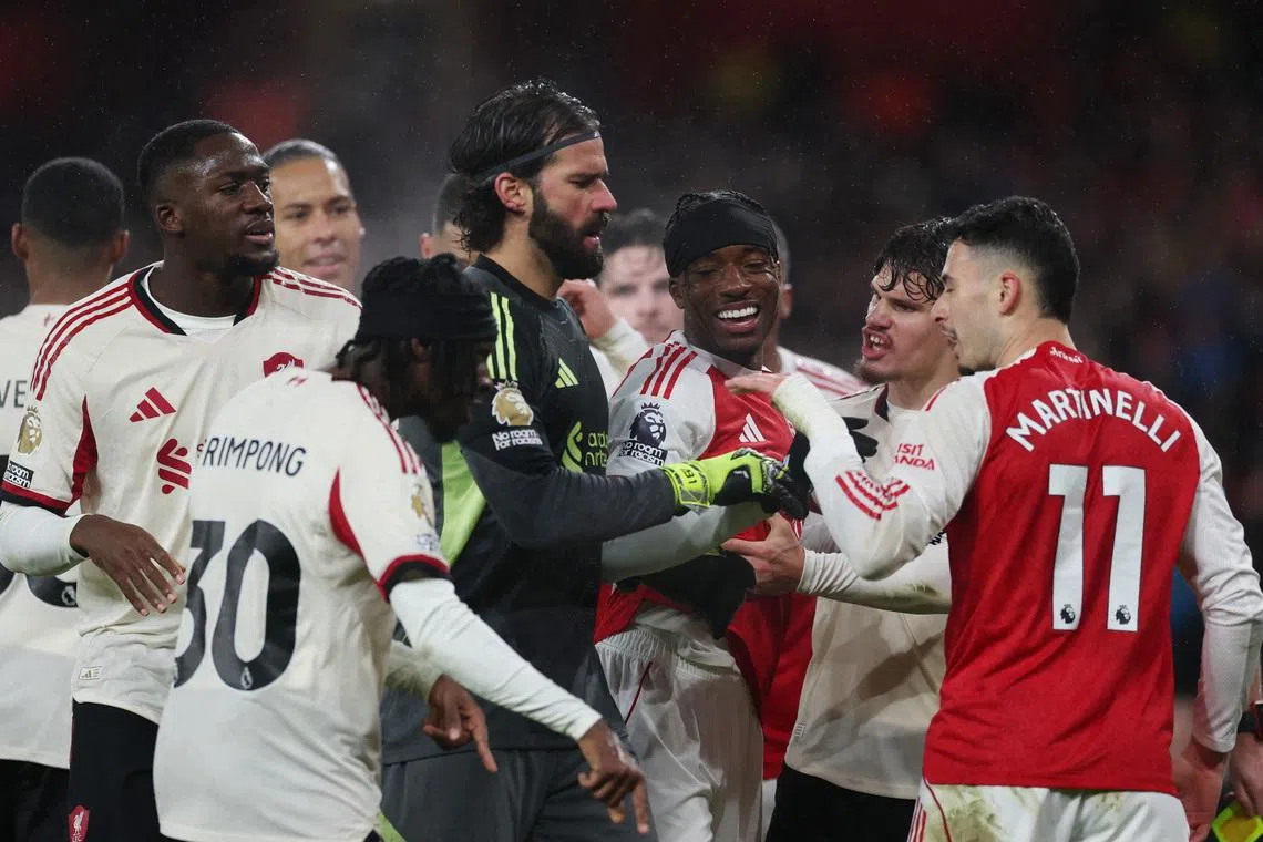 Soccer Football - Premier League - Arsenal v Liverpool - Emirates Stadium, London, Britain - January 8, 2026 Players from both teams react as Liverpool's Ibrahima Konate clashes with Arsenal's Gabriel Martinelli Action Images via Reuters/Paul Childs