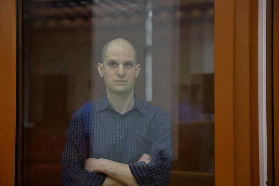 Wall Street Journal reporter Evan Gershkovich, who stands trial on spying charges, is seen inside an enclosure for defendants before a court hearing in Yekaterinburg, Russia June 26, 2024. REUTERS/Evgenia Novozhenina/File Photo