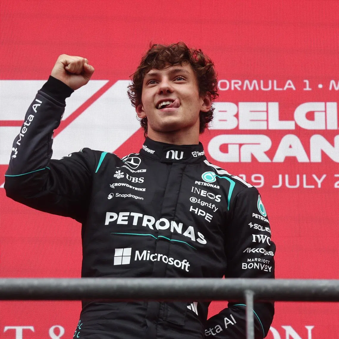 Mercedes’ Andrea Kimi Antonelli celebrates on the podium after winning the Belgian Grand Prix.