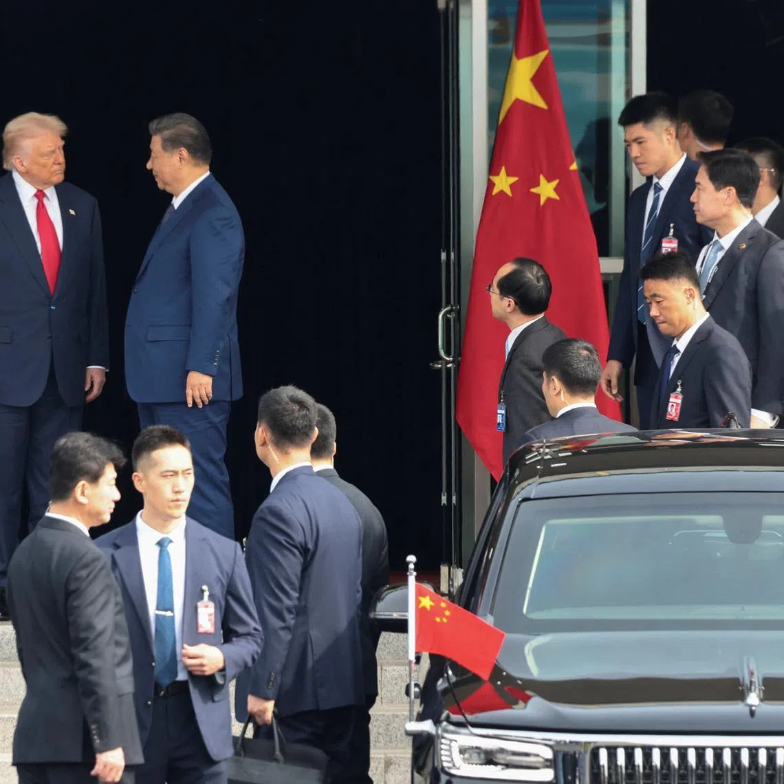 U.S. President Donald Trump and Chinese President Xi Jinping talk as they leave after a bilateral meeting at Gimhae International Airport, on the sidelines of the Asia-Pacific Economic Cooperation (APEC) summit, in Busan, South Korea, October 30, 2025. REUTERS/Evelyn Hockstein