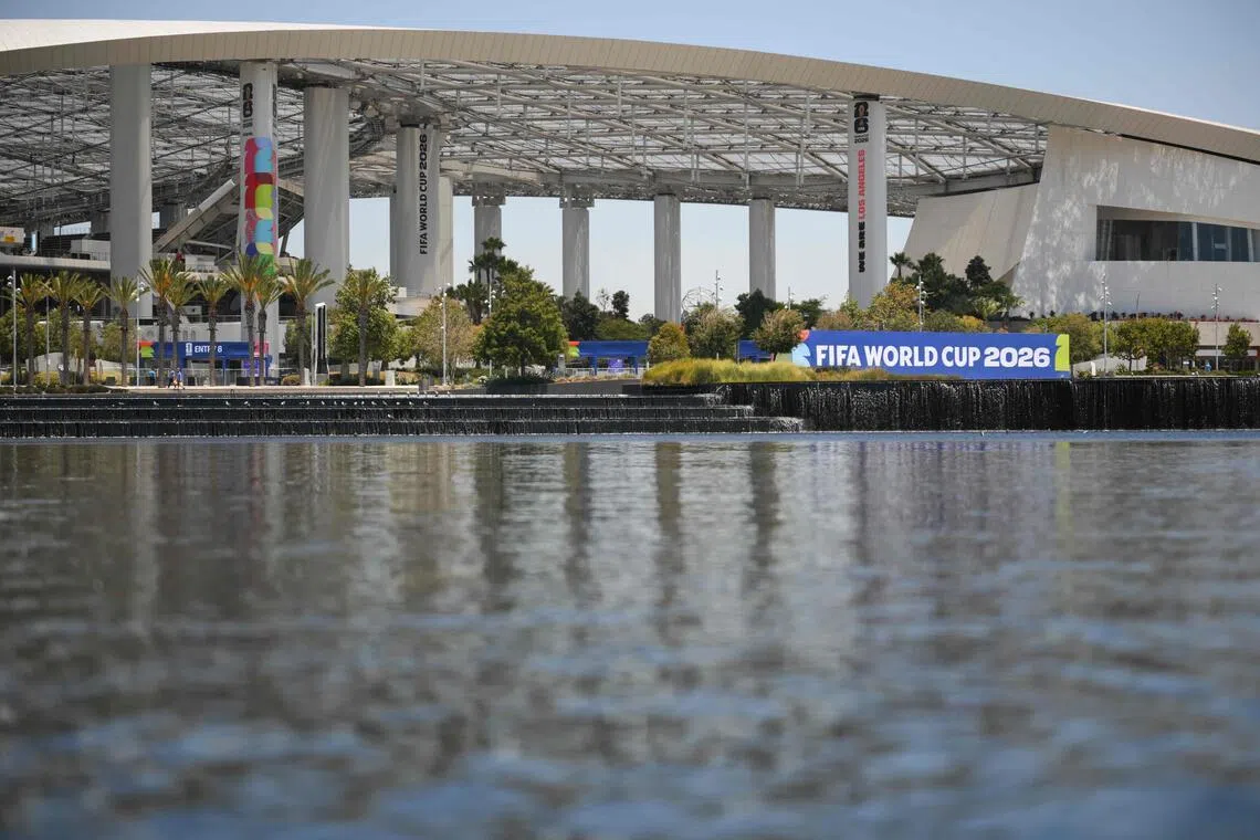 Los Angeles Stadium (temporarily renamed from SoFi Stadium) stands across Lake Park as it prepares to host World Cup matches.