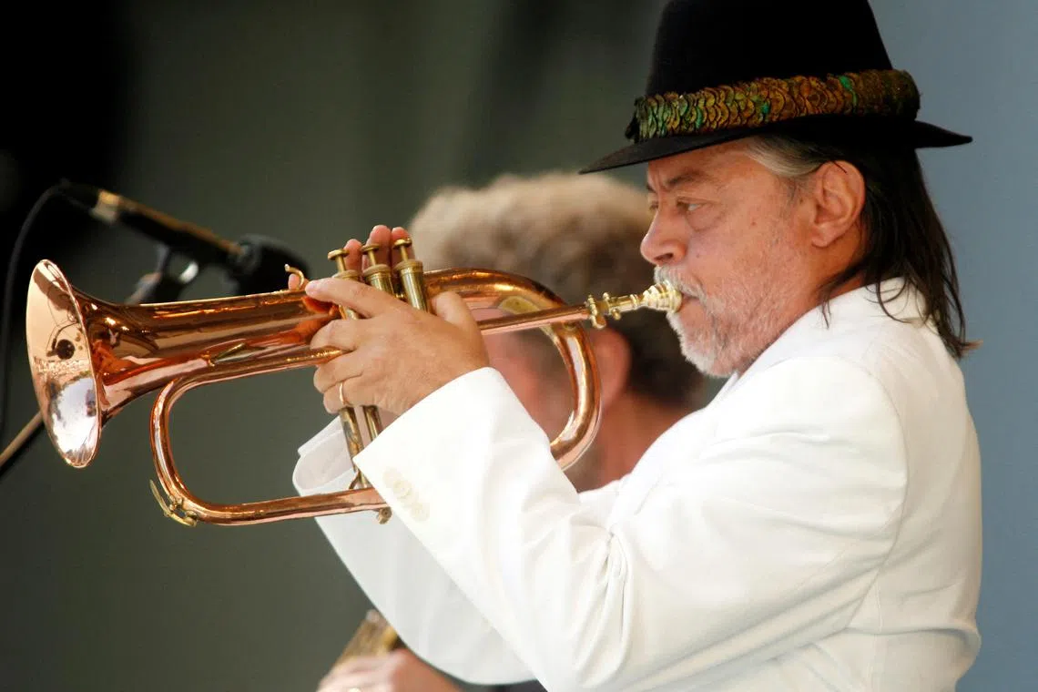 FILE PHOTO: Jazz musician Chuck Mangione plays the flugelhorn as he performs at the 28th annual Playboy Jazz Festival at the Hollywood Bowl in Hollywood June 18, 2006. REUTERS/Fred Prouser/File Photo