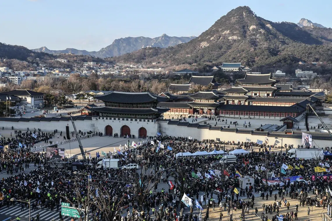 Protesters gather outside Gyeongbokgung Palace during a rally by civic groups calling for South Korean President Yoon Suk Yeol's resignation in Seoul on Dec 28.