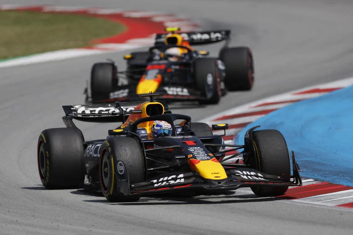 FILE PHOTO: Formula One F1 - Spanish Grand Prix - Circuit de Barcelona-Catalunya, Barcelona, Spain - June 1, 2025 Red Bull's Max Verstappen and Red Bull's Yuki Tsunoda in action during the race REUTERS/Juan Medina/File Photo