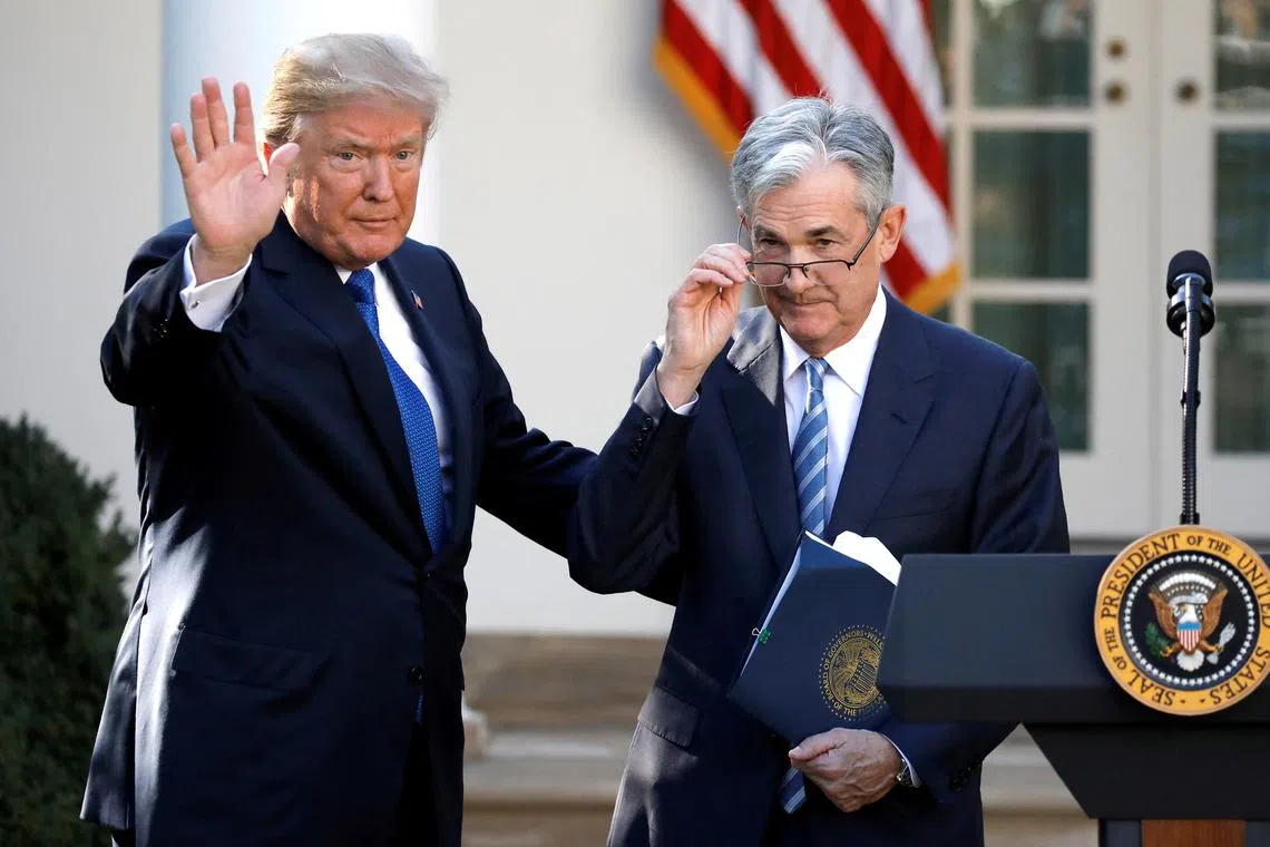 In November, Jerome Powell (right) said he would refuse to leave office early if Donald Trump tried to oust him.