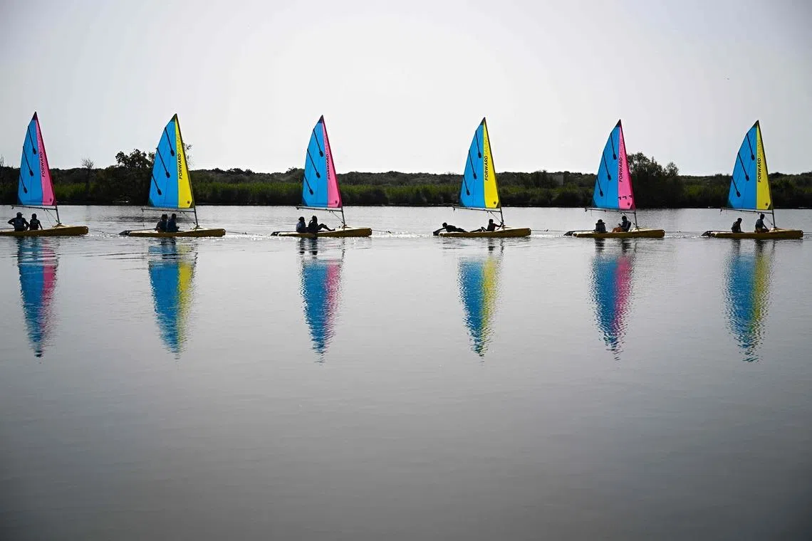 Catamaran sailboats from the Valras-Plage sailing school setting sail for a lesson on April 21.