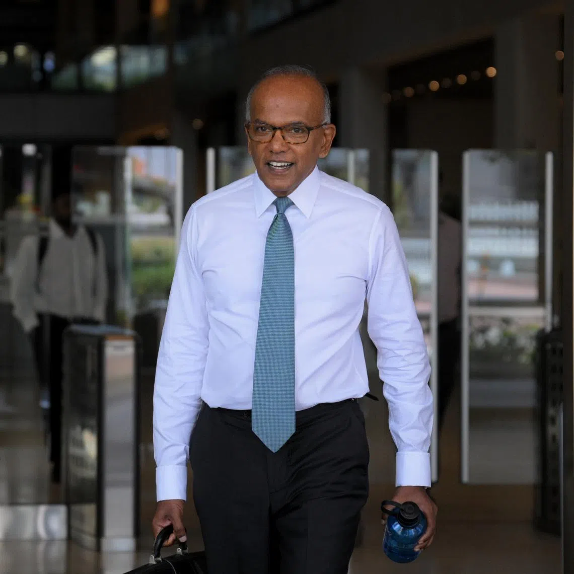 Coordinating Minister for National Security K. Shanmugam leaving the High Court on April 8.