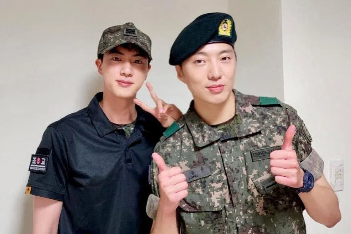 BTS' Jin (left) and Winner's Seungyoon were in the same army camp.