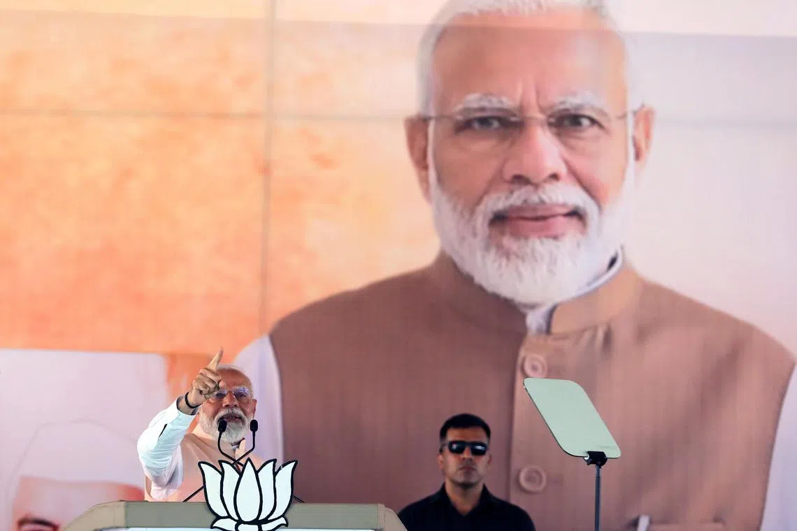 epa11253187 Indian Prime Minister Narendra Modi (L) speaks during the Bharatiya Janata Party and its alliance partners' first election rally in Meerut, India, 31 March 2024. General elections in India will be held in seven phases between 19 April and 01 June 2024. Elections for India's 545-member lower house of parliament, or Lok Sabha, are held every five years.  EPA-EFE/RAJAT GUPTA