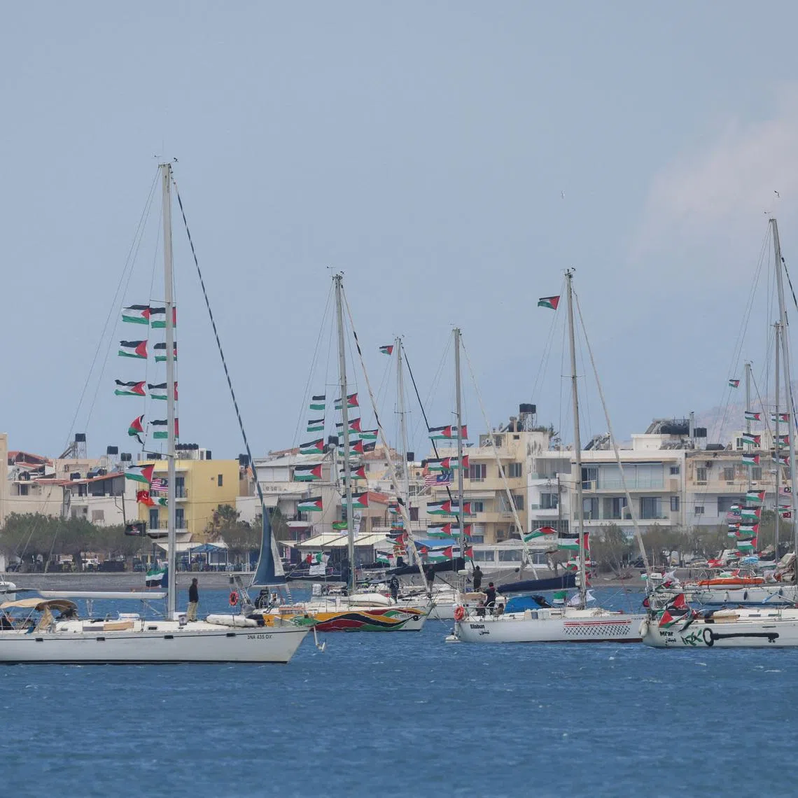Vessels of the Global Sumud Flotilla, which was intercepted on international waters by the Israeli Navy, sail off the city of Ierapetra, on the island of Crete, Greece, May 1, 2026. REUTERS/Stefanos Rapanis