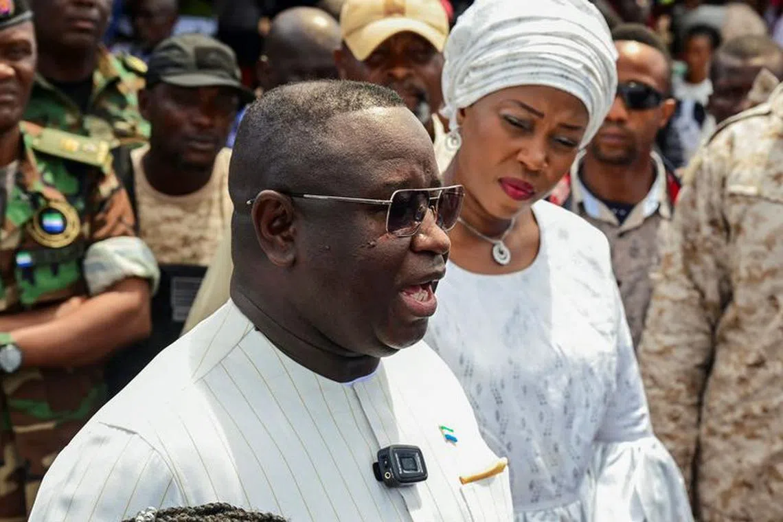 FILE PHOTO: Sierra Leone's President and ruling party candidate Julius Maada Bio speaks to journalists after casting his vote for national elections at a polling station in Freetown, Sierra Leone, June 24, 2023. REUTERS/Cooper Inveen/File Photo