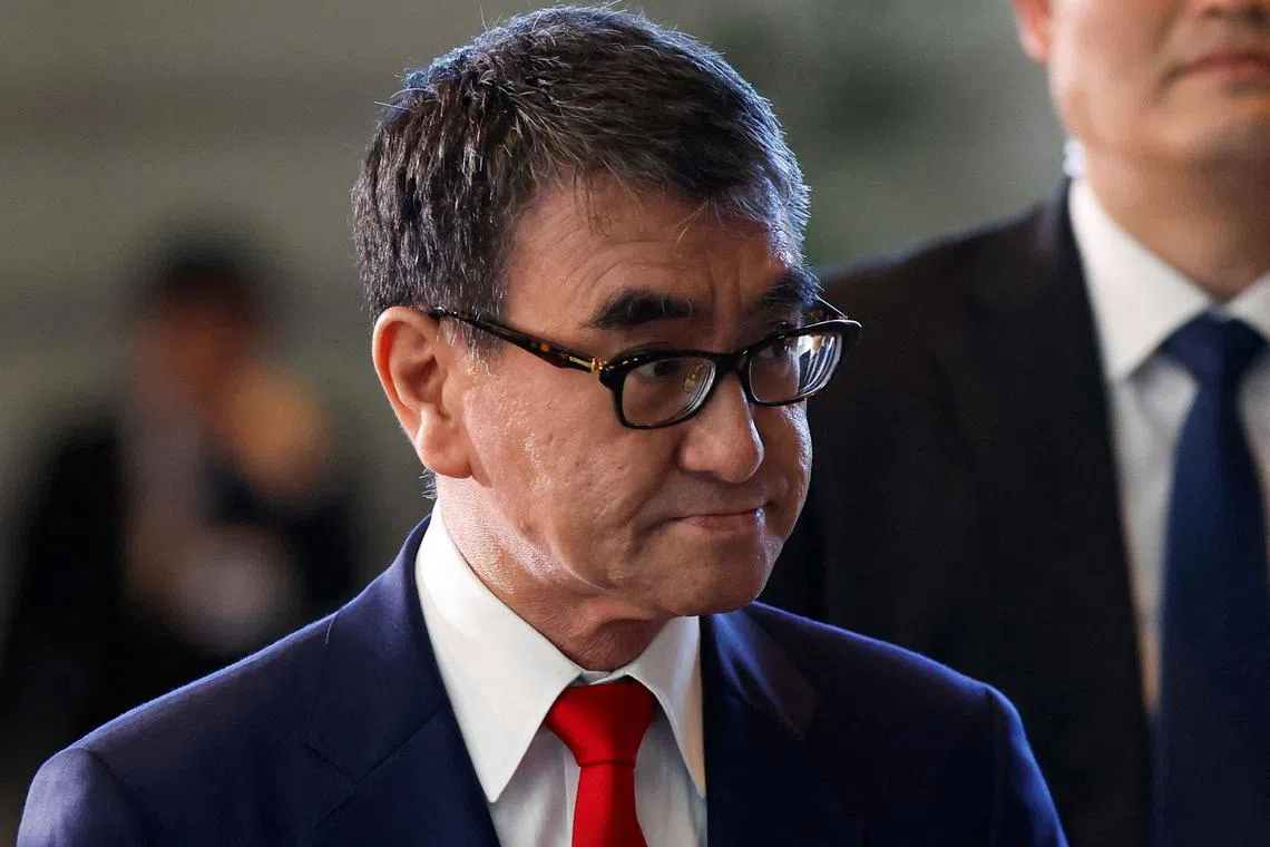 FILE PHOTO: Japan's Minister for Digital Transformation Taro Kono walks on the day of the cabinet reshuffle, at the Prime Minister's office in Tokyo, Japan September 13, 2023. REUTERS/Issei Kato/File Photo
