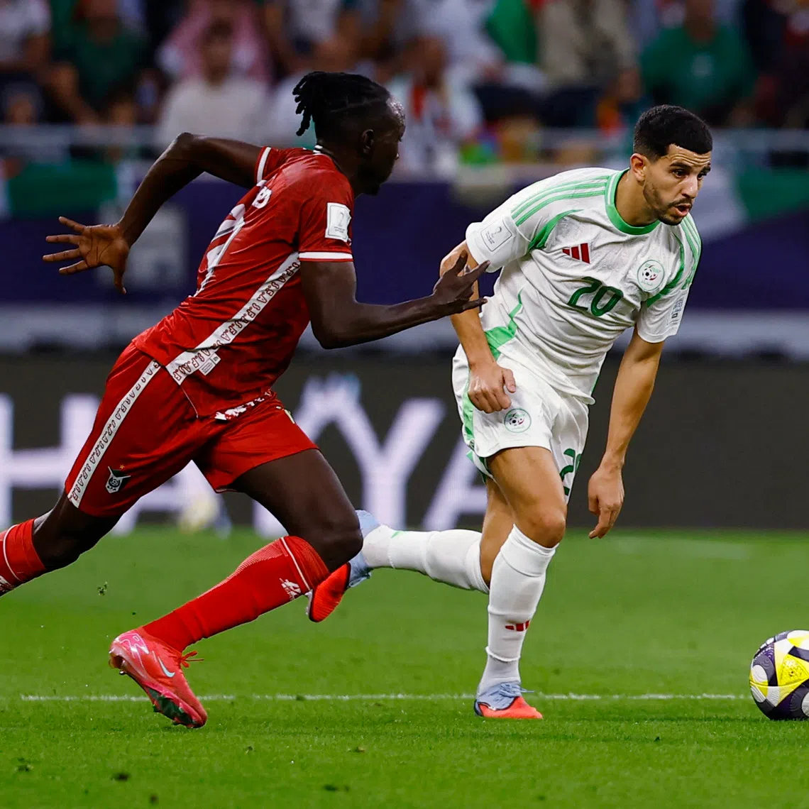 Soccer Football - FIFA Arab Cup - Qatar 2025 - Group D - Algeria v Sudan - Al Rayyan Stadium, Al Rayyan, Qatar - December 3, 2025 Algeria's Youcef Atal in action with Sudan's Mazin Fadul Al-Bahli REUTERS/Rula Rouhana