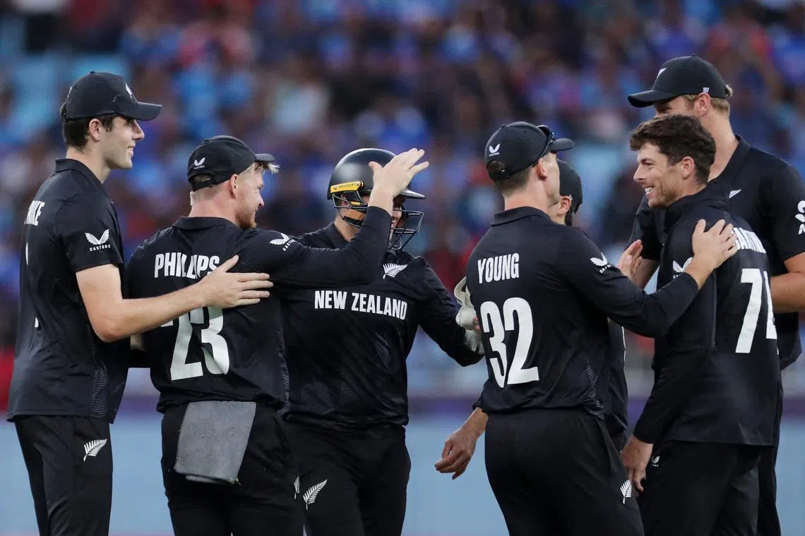 Cricket - ICC Men's Champions Trophy - Final - India v New Zealand - Dubai International Stadium, Dubai, United Arab Emirates - March 9, 2025 New Zealand's Mitchell Santner celebrates with teammates after taking the wicket of India's Shubman Gill, caught out by Glenn Phillips REUTERS/Satish Kumar