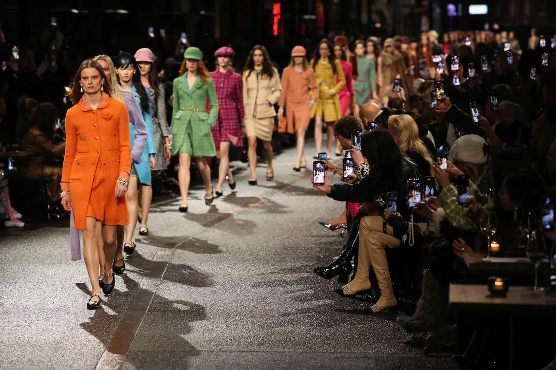 Models presenting creations at the Chanel Metiers d'Art runway show, in Manchester, Britain Dec 7, 2023. 