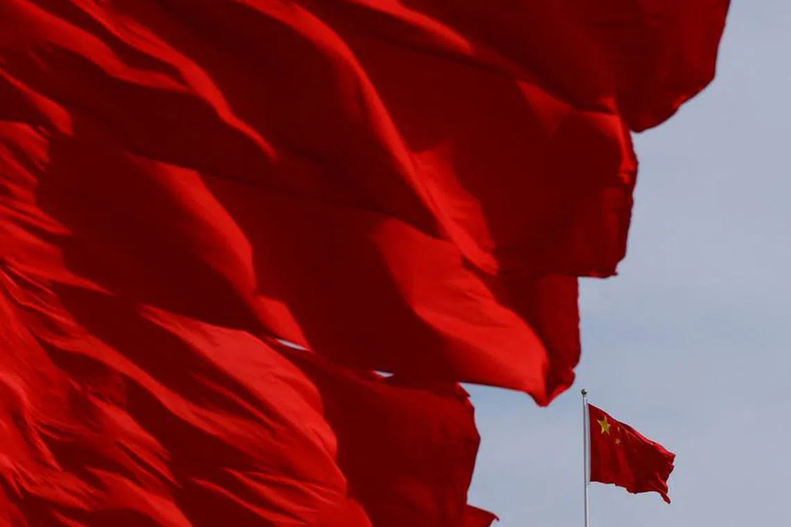 Flags flutter in the wind during the opening ceremony of the Belt and Road Forum (BRF) to mark the 10th anniversary of the Belt and Road Initiative at the Great Hall of the People in Beijing, China October 18, 2023. REUTERS/Edgar Su
