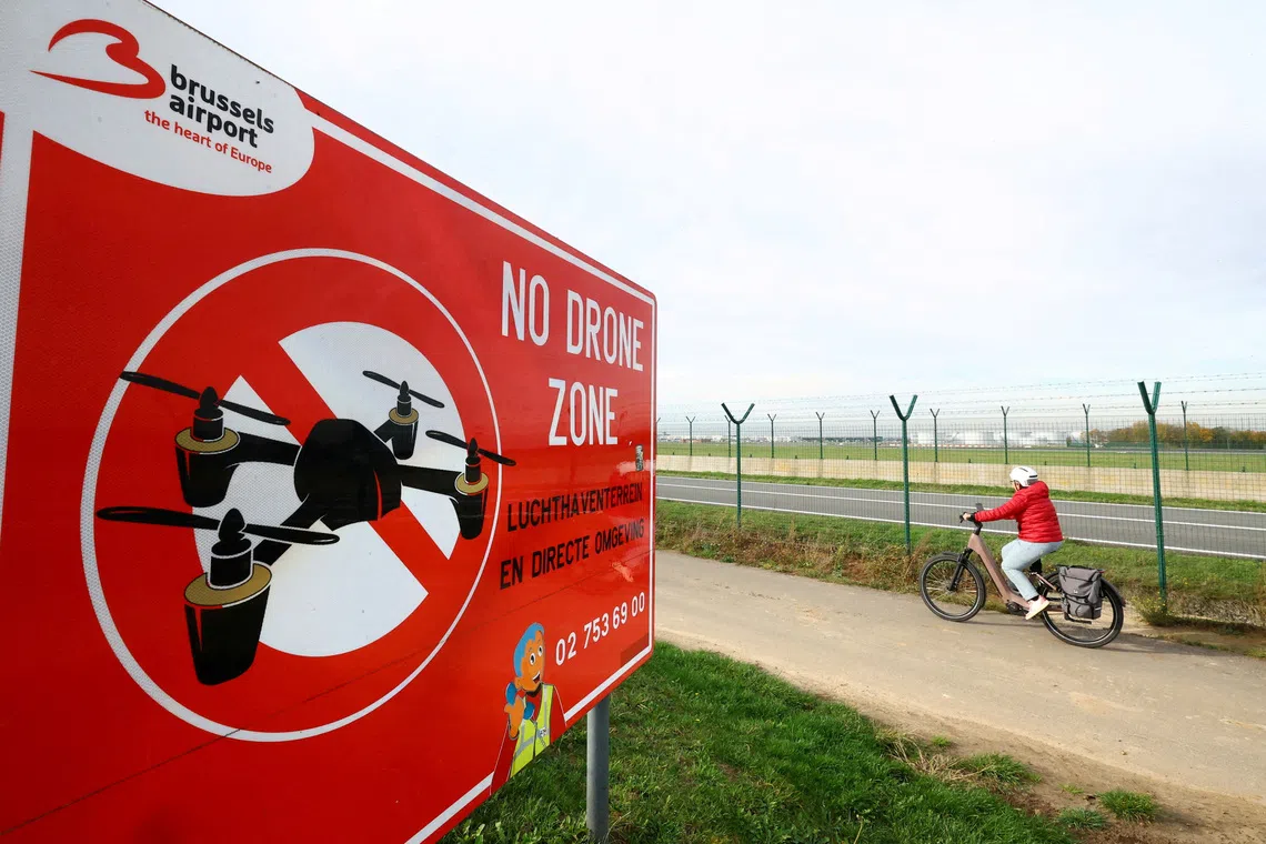 FILE PHOTO: A \"No Drone Zone\" placard at Brussels international Airport in Zaventem on the day of an emergency meeting of Belgian government officials and experts, following drone sightings that closed Brussels Airport, in Zaventem, Belgium, November 6, 2025. REUTERS/Yves Herman/File Photo