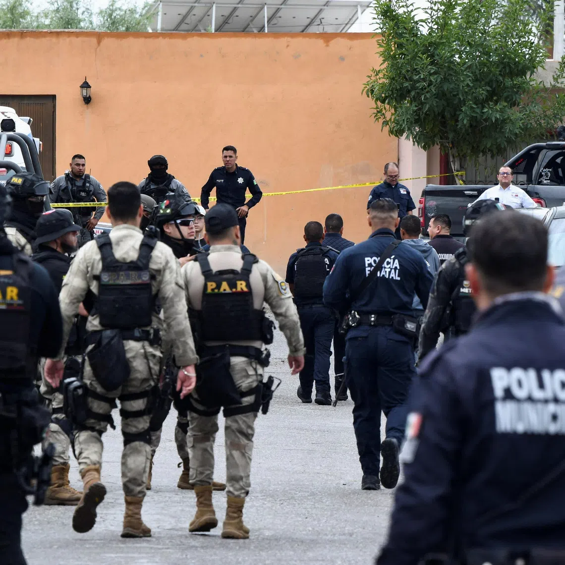 Security forces keep watch outside Secondary School No. 13 after an attack that killed a vice principal and injured others, according to local authorities, in Torreon, Coahuila state, Mexico, October 1, 2026. REUTERS/Stringer