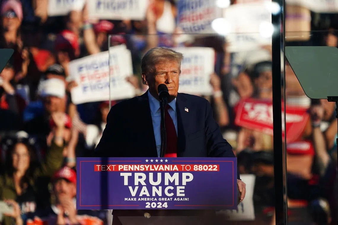 Former US president and Republican presidential nominee Donald Trump speaks at a rally in Butler, Pennsylvania, on Oct 5. The rally took place at the same location where a gunman attempted to assassinate him in July. 