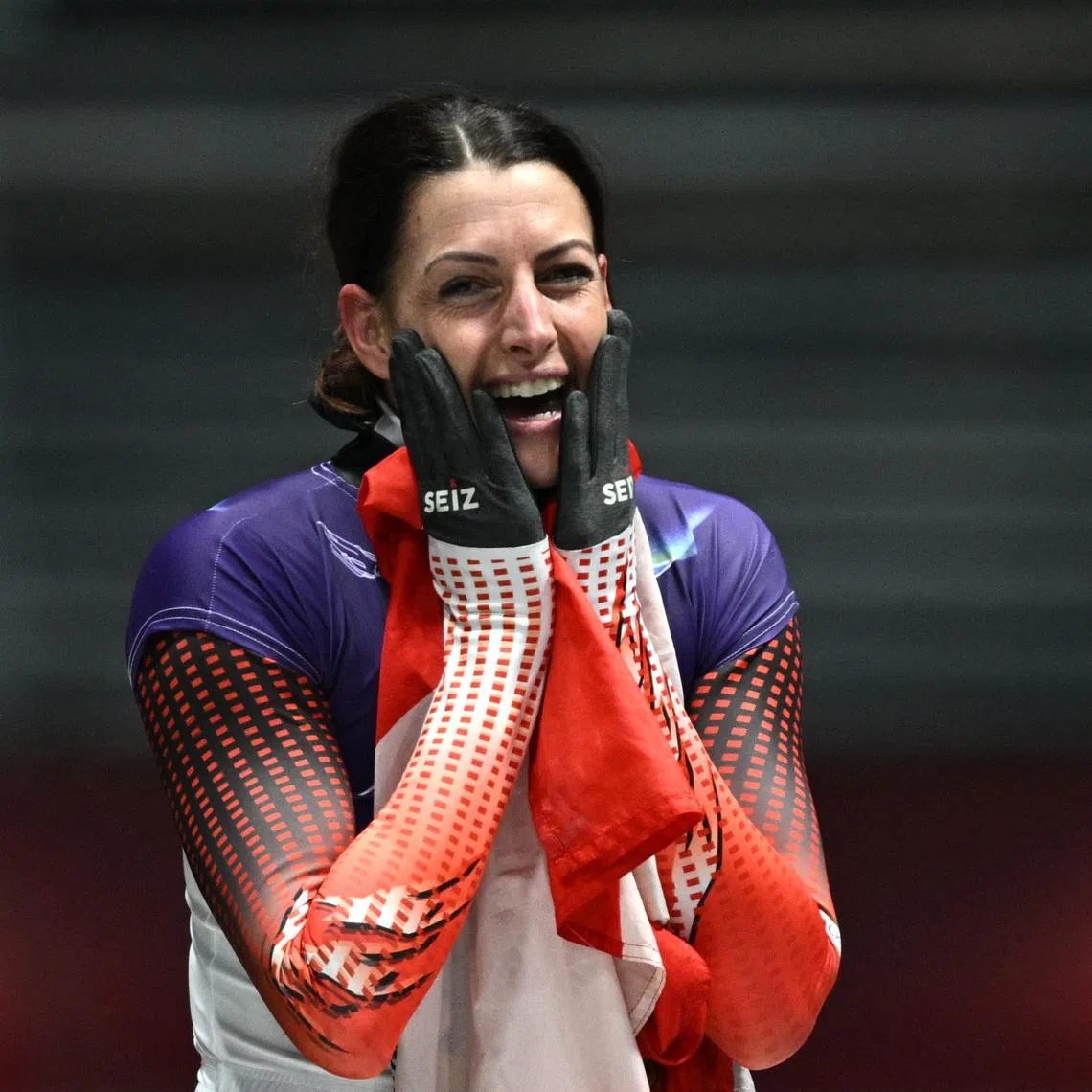 Milano Cortina 2026 Olympics - Skeleton - Women Heat 4 - Cortina Sliding Centre, Cortina d'Ampezzo, Italy - February 14, 2026. Gold medallist Janine Flock of Austria reacts after her run REUTERS/Annegret Hilse