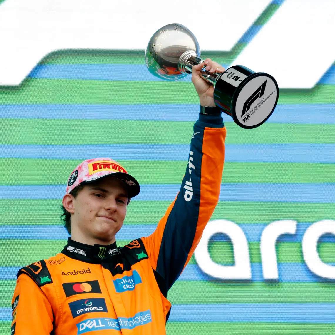 Formula One F1 - Japanese Grand Prix - Suzuka Circuit, Suzuka, Japan - March 29, 2026 McLaren's Oscar Piastri celebrates his second place on the podium with a trophy after the Japanese Grand Prix. REUTERS/Kim Kyung-Hoon