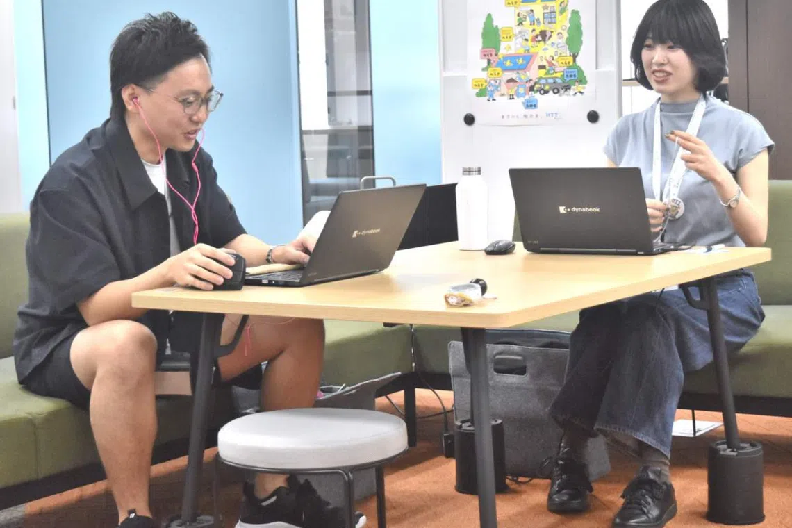 A Tokyo metropolitan government Bureau of Environment employee wears a short-sleeved shirt and shorts at the Tokyo metropolitan government building on April 22, 2026.