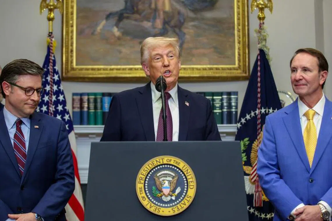 US House Speaker Mike Johnson, a Republican from Louisiana, from left, US President Donald Trump, and Jeff Landry, governor of Lousiana, in the Roosevelt Room of the White House in Washington, DC, US, on Monday, March 24, 2025. Trump celebrated plans by Hyundai Motor Co. to mount a significant expansion in the US, casting it as a vindication of his administration's use of tariffs to pressure foreign manufacturers to create American jobs. Photographer: Samuel Corum/Sipa/Bloomberg
