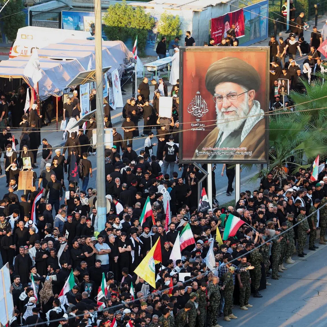 People gather on the day of a funeral procession for Iran’s late Supreme Leader Ayatollah Ali Khamenei in Najaf, Iraq, on July 8.