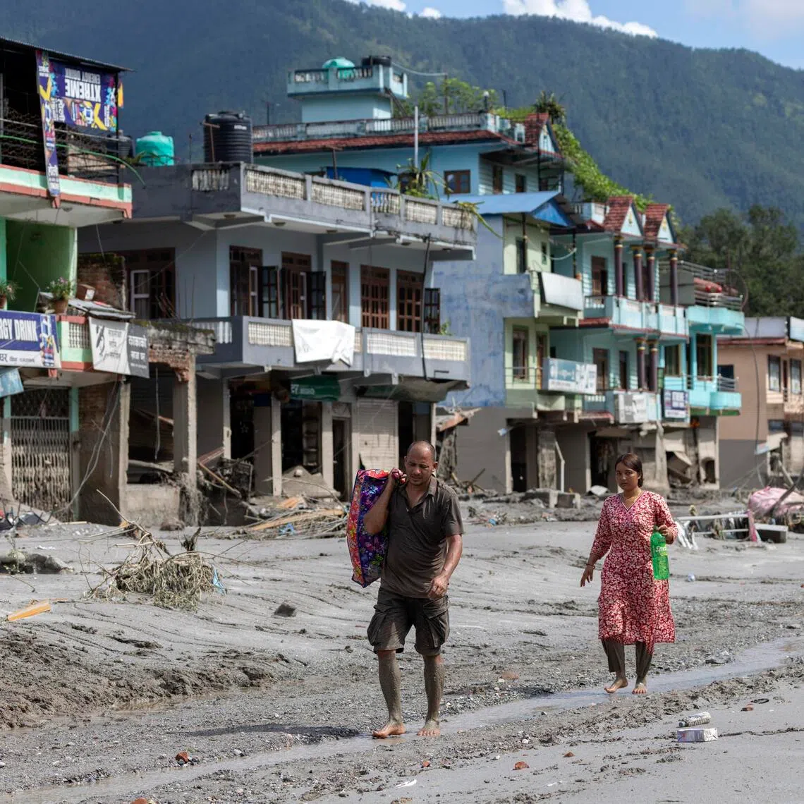 Across Nepal’s flood disaster zone, survivors are returning to villages reduced to mud and debris, searching for belongings, documents and fragments of lives swept away in minutes.