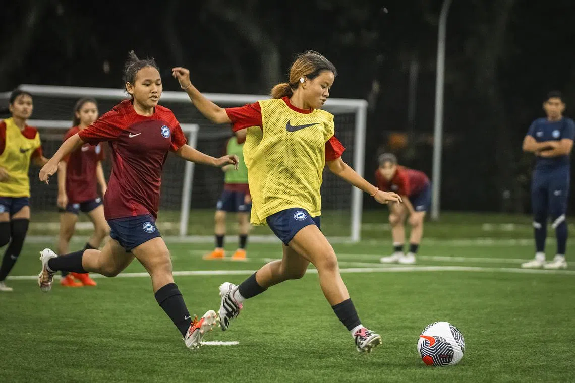 Singapore national women's football team's Natasha Naszri (left) and Chloe Koh in training ahead of the team's international friendly against Macau on July 18.