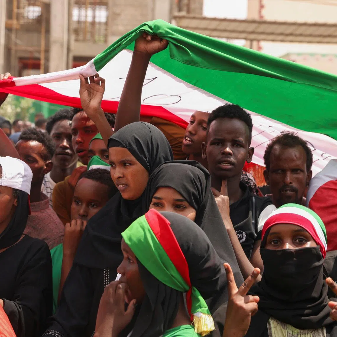 FILE PHOTO: People hold the flag of Somaliland during the parade in Hargeisa, Somaliland, May 18, 2024. REUTERS/Tiksa Negeri/File Photo