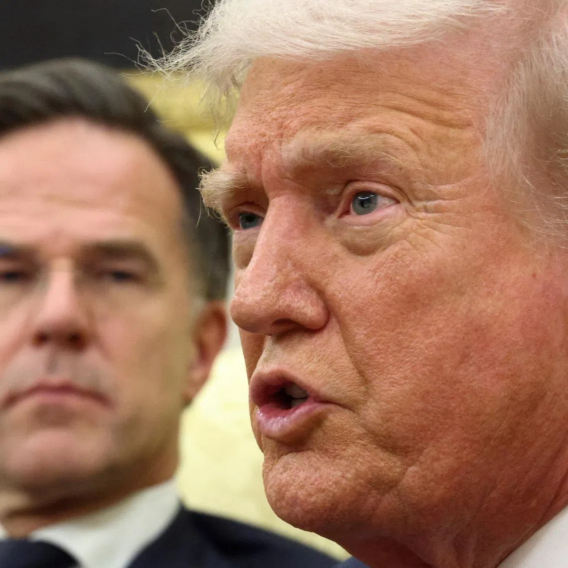 U.S. President Donald Trump speaks as he meets with Secretary General of the North Atlantic Treaty Organization (NATO) Mark Rutte in the Oval Office of the White House in Washington, D.C., U.S., October 22, 2025.  REUTERS/Kevin Lamarque