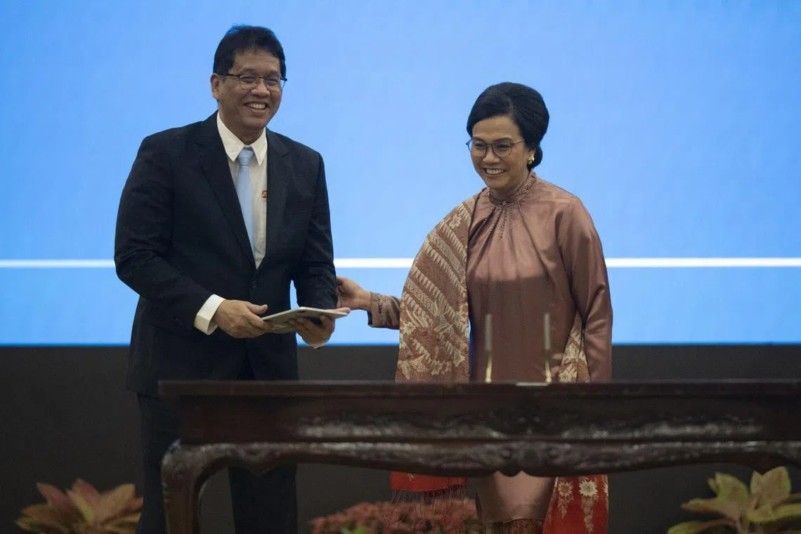 Outgoing finance minister Sri Mulyani Indrawati and her successor Purbaya Yudhi Sadewa at a handover ceremony in Jakarta on Sept 9. 