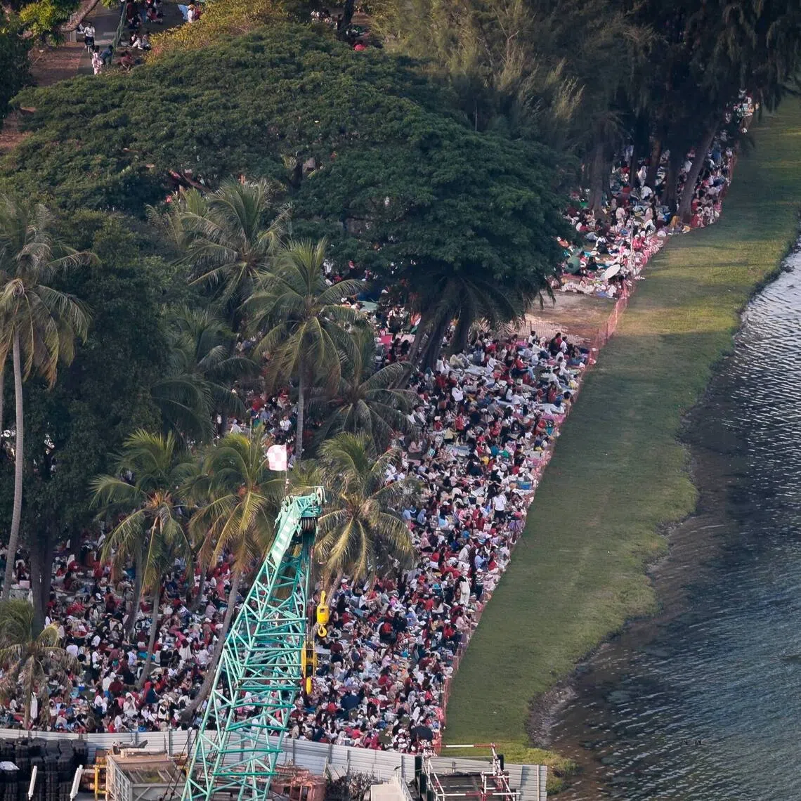 A crowd gathering near Republic Avenue to watch the National Day Parade fireworks on Aug 9.