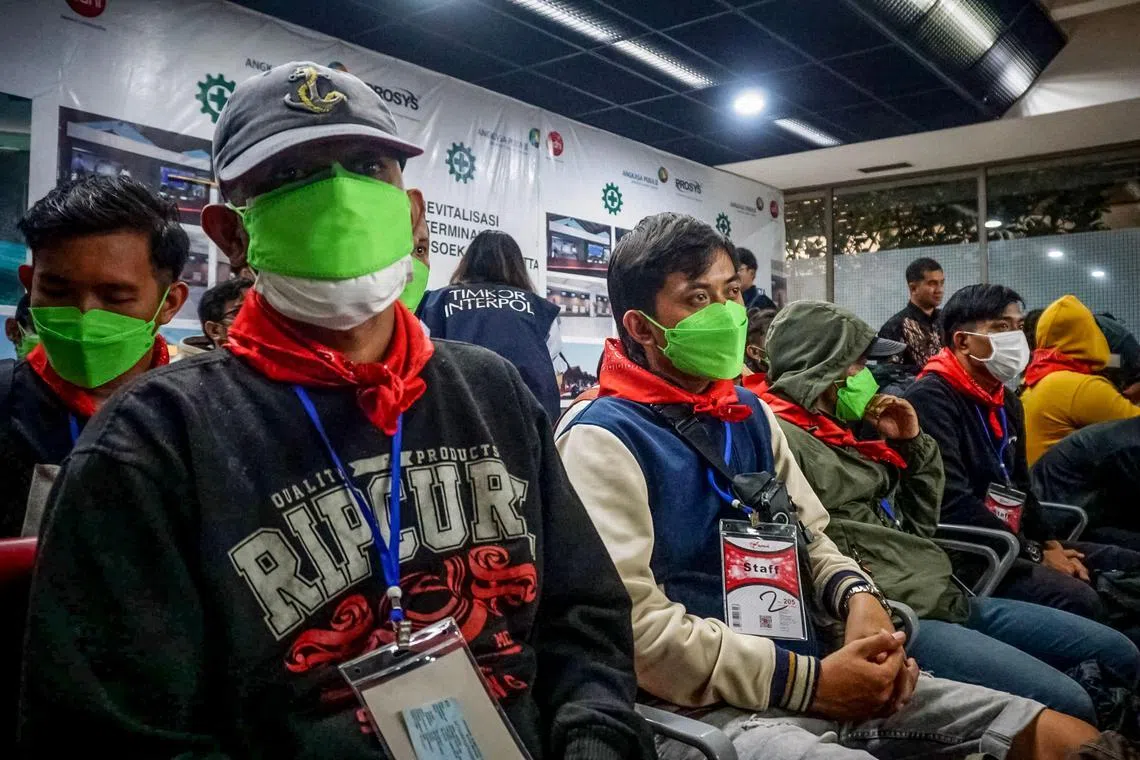 Indonesians roped into online scams in in Myanmar arrive in Tangerang, Banten province, in Indonesia on Feb 28.