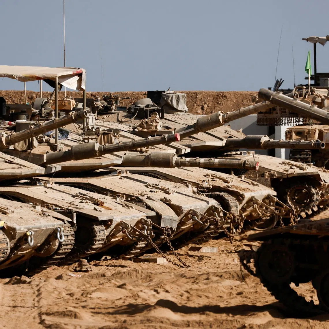 Israeli military vehicles stand near the Israel-Gaza border, in Israel July 7, 2025. REUTERS/Amir Cohen