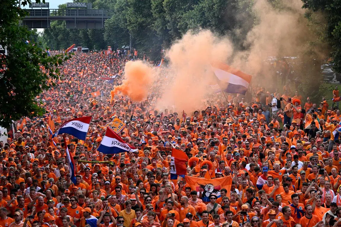 Dutch fans cheering in the streets of Dortmund on July 10, before their Euro 2024 semi-final football match against England played in the city later in the day.