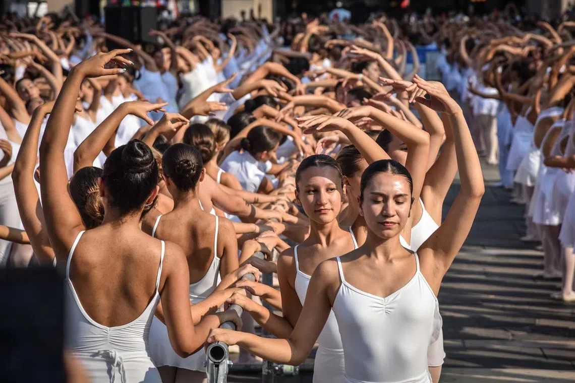 Dancers participate in the 'On Dance' event at the Piazza Duomo cathedral square in Milan, Italy, Sept 10. 