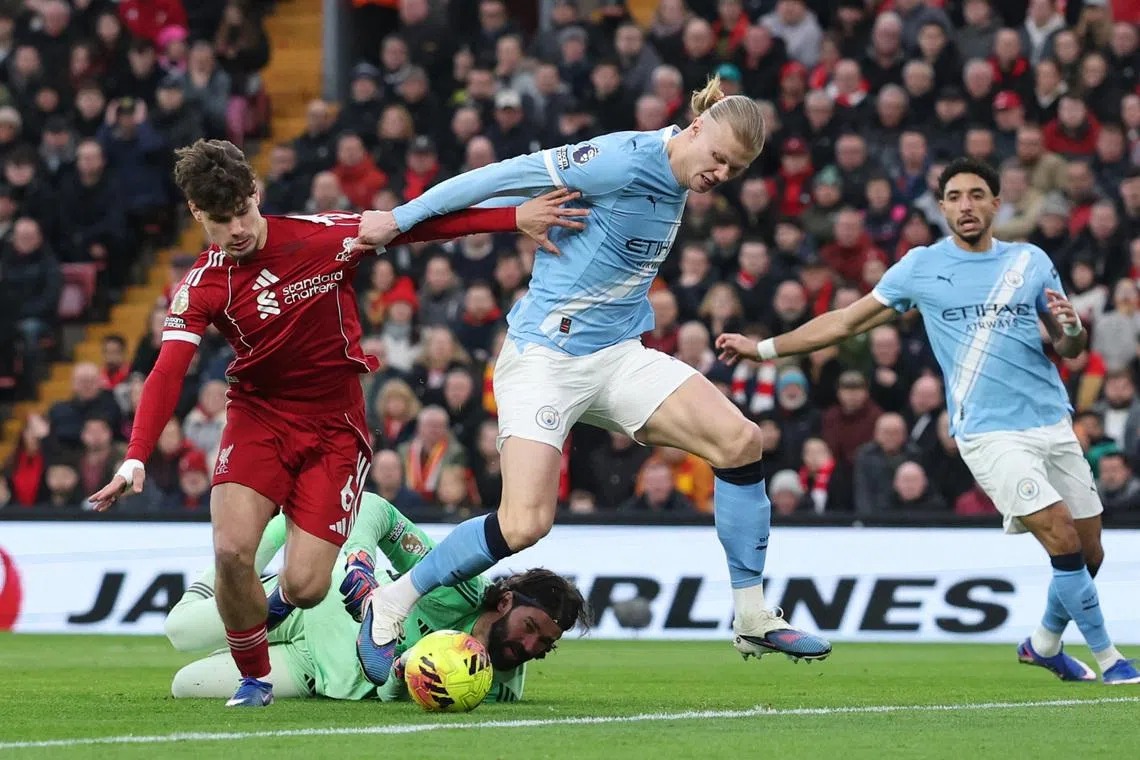 Man City snatch chaotic 2-1 win at Liverpool to stay on Arsenal's heels
