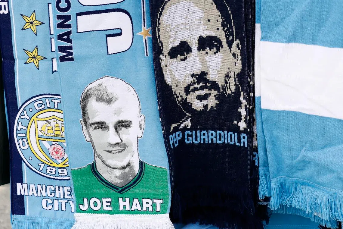 Britain Football Soccer - Manchester City v Everton - Premier League - Etihad Stadium - 15/10/16
Joe Hart and Pep Guardiola scarves for sale outside the stadium before the match 
Action Images via Reuters / Jason Cairnduff