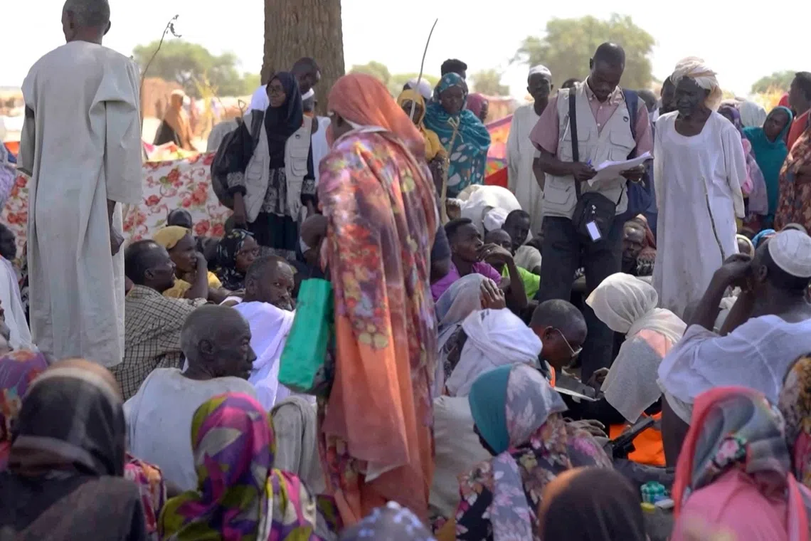 FILE PHOTO: Displaced Sudanese gather after fleeing Al-Fashir city in Darfur, in Tawila, Sudan, October 29, 2025, in this still image taken from a Reuters' video. REUTERS/Mohamed Jamal/File Photo