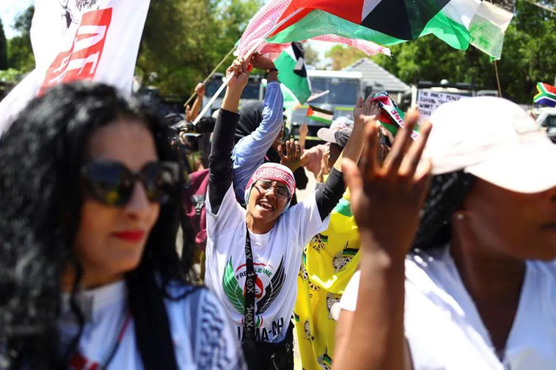 Suppoters of South Africa's ruling African National Congress (ANC) and various political parties including civil society groups gather in solidarity with the Palestinian people outside the Israeli embassy in Pretoria, south Africa, October 20, 2023. REUTERS/Siphiwe sibeko/File Photo