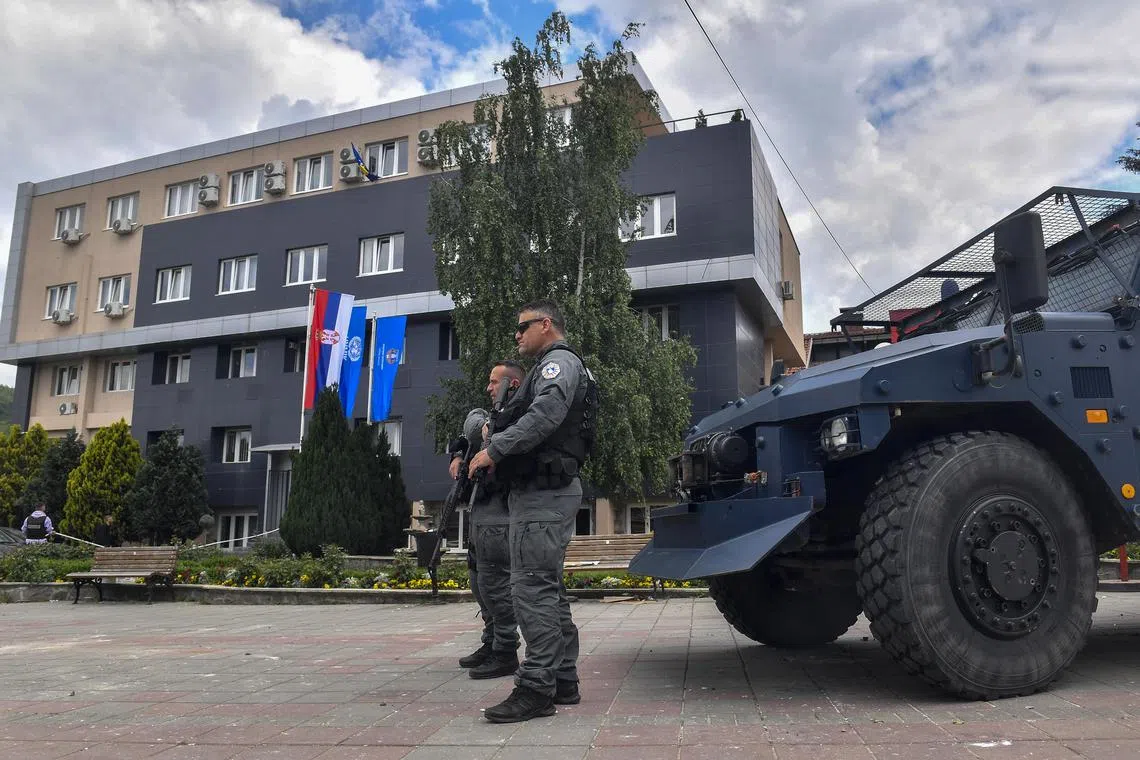 Kosovar police officers secure the building of the municipality in Leposavic, Kosovo, on May 27.