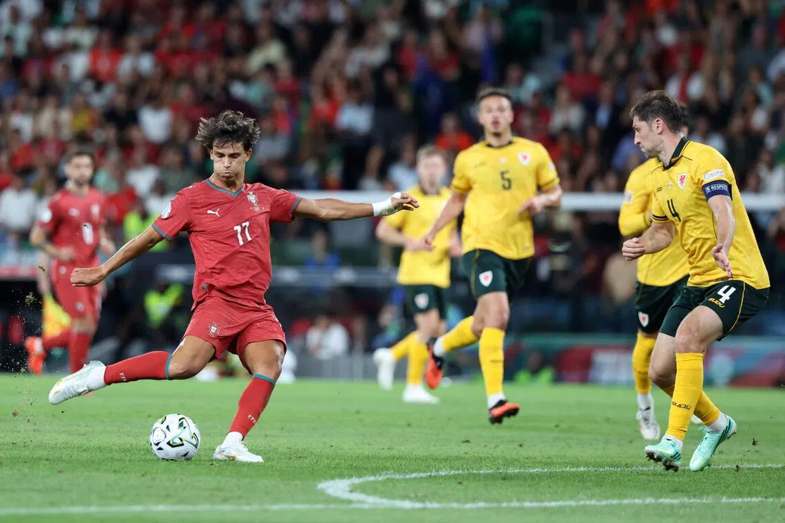 Portugal’s Joao Felix shooting to score, during their UEFA Nations League match against Wales on Sept 24 in Lisbon.
