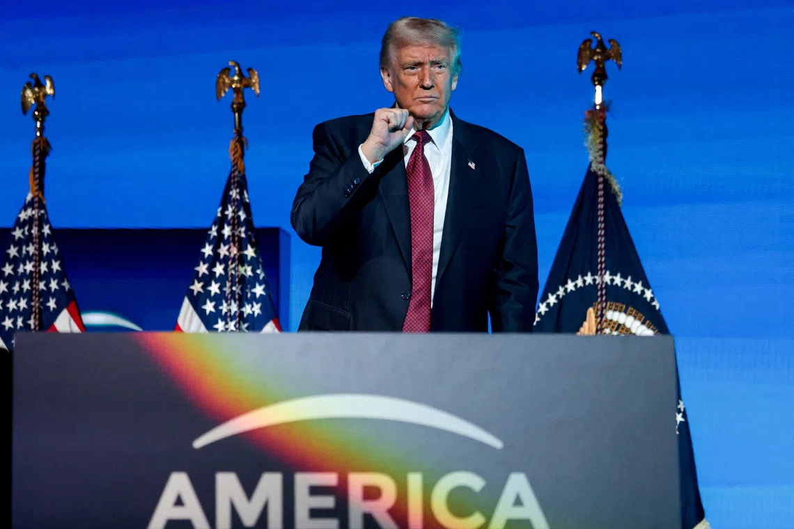 FILE PHOTO: U.S. President Donald Trump gestures during the American Business Forum Miami at the Kaseya Center Arena in Miami, Florida, U.S. November 5, 2025. REUTERS/Jonathan Ernst/File Photo
