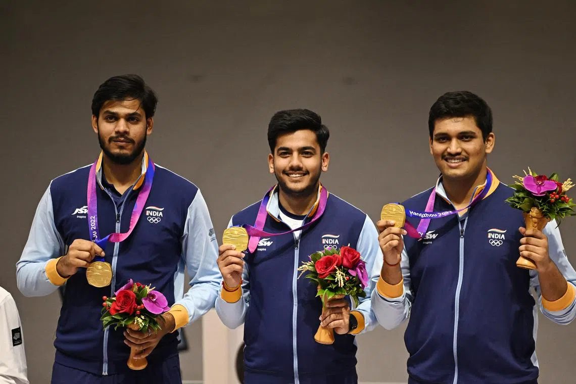 (From left) India's Divyansh Singh Panwar, Aishwary Pratap Singh Tomar and Rudrankksh Patil celebrating their men's 10m air rifle team win.